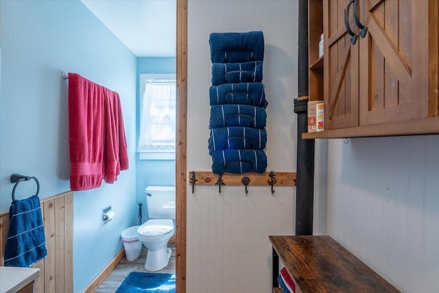 433 N Union Rd, Union, ME 04862 - bathroom with toilet, baseboards, and wood finished floors
