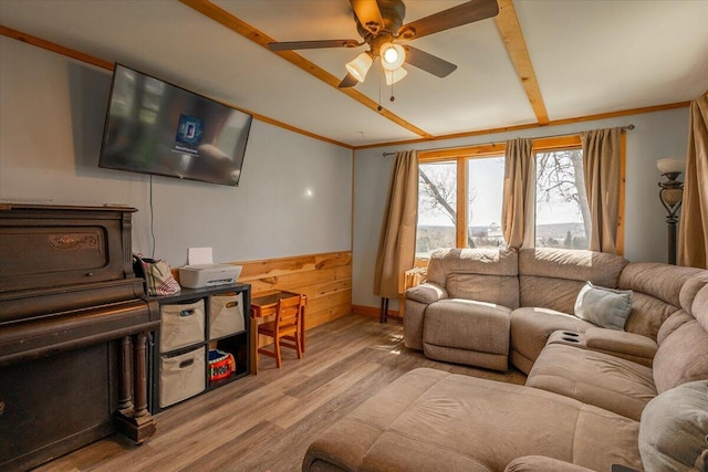 433 N Union Rd, Union, ME 04862 - living room featuring a ceiling fan, lofted ceiling with beams, ornamental molding, and light wood-type flooring