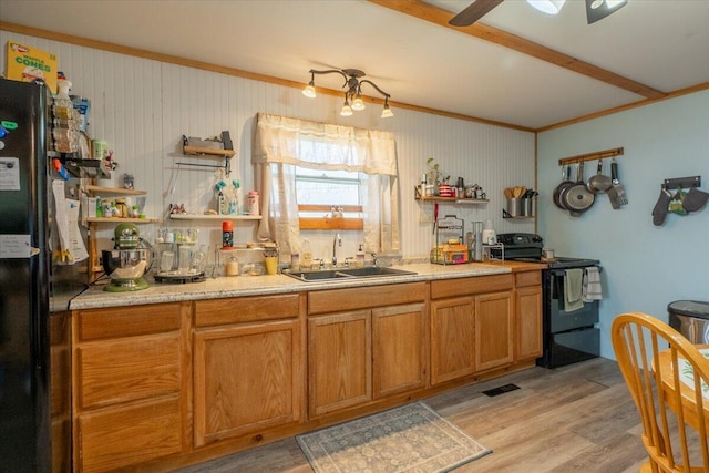 433 N Union Rd, Union, ME 04862 - kitchen featuring open shelves, a sink, light countertops, black appliances, and light wood finished floors