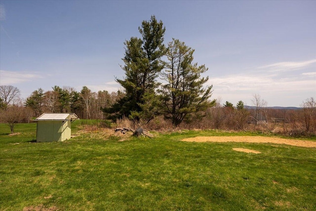 433 N Union Rd, Union, ME 04862 - view of yard featuring a shed and an outbuilding
