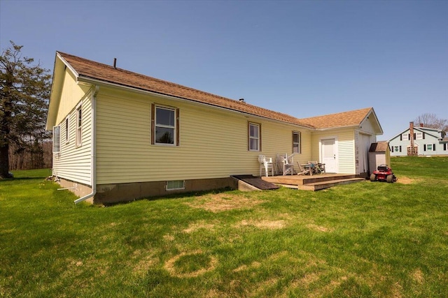 433 N Union Rd, Union, ME 04862 - back of property featuring an attached garage, a wooden deck, and a yard