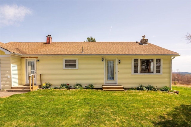 433 N Union Rd, Union, ME 04862 - rear view of house with a yard, a chimney, and a shingled roof