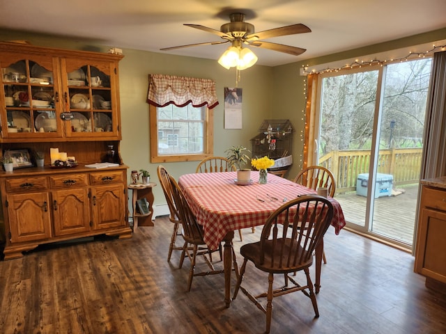 53 Village Rd, Stetson, ME 04488 - dining space featuring dark wood finished floors, ceiling fan, and baseboard heating