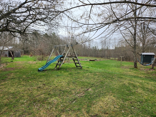 53 Village Rd, Stetson, ME 04488 - view of green lawn featuring a playground