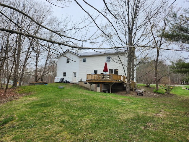 53 Village Rd, Stetson, ME 04488 - rear view of house with a wooden deck and a yard