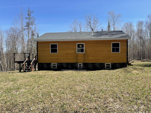 144 Redneck Rd, Starks, ME 04911 - view of home's exterior featuring a lawn and stairs