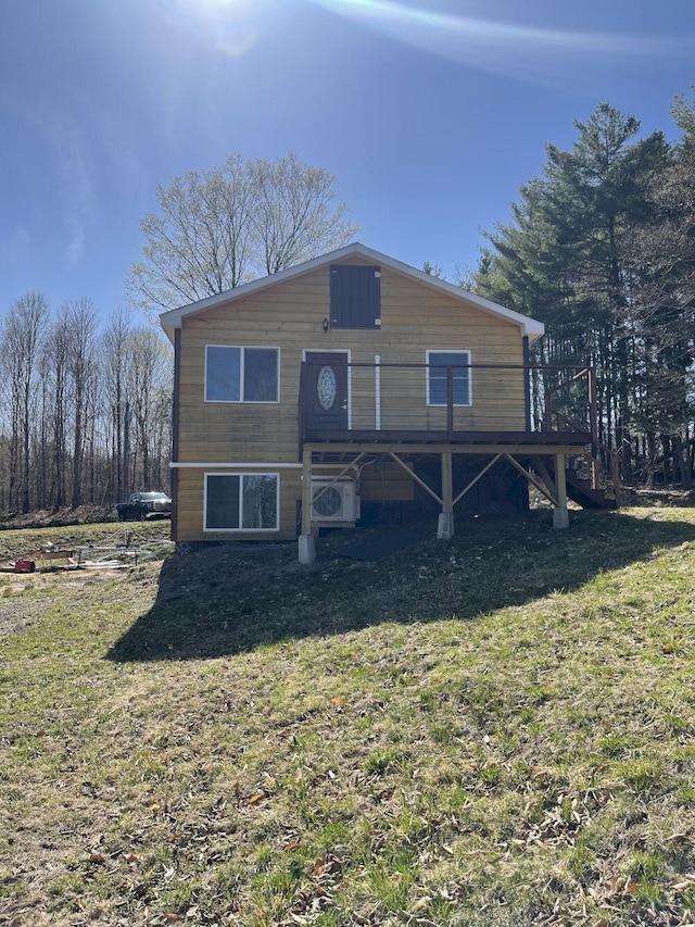 144 Redneck Rd, Starks, ME 04911 - rear view of house with a lawn, a cooling unit, and a wooden deck