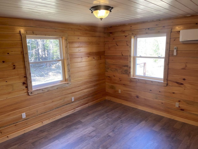144 Redneck Rd, Starks, ME 04911 - unfurnished room with plenty of natural light, a wall mounted air conditioner, wooden walls, wood finished floors, and wooden ceiling