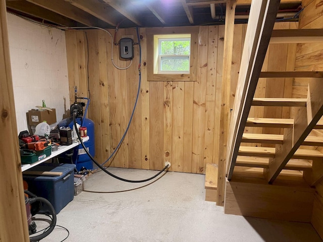 144 Redneck Rd, Starks, ME 04911 - below grade area featuring stairway, wood walls, and a water pressure tank