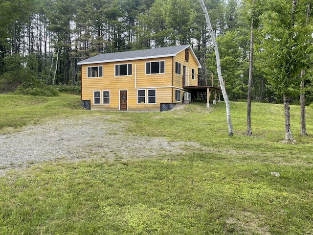 144 Redneck Rd, Starks, ME 04911 - view of front of property featuring a front lawn, view of scattered trees, and a wooden deck
