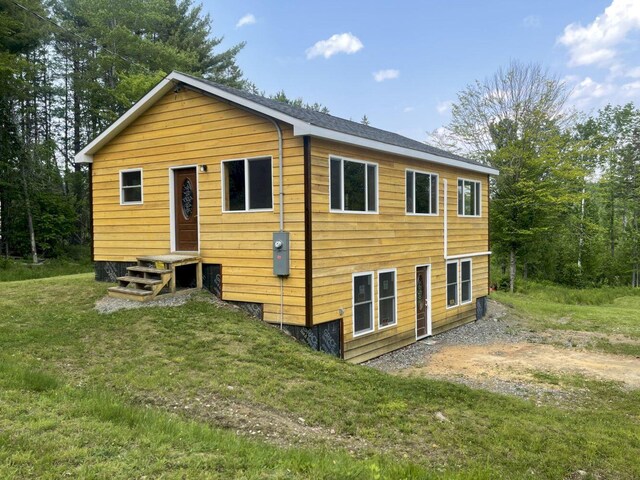 144 Redneck Rd, Starks, ME 04911 - rear view of property with a lawn