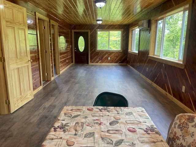 144 Redneck Rd, Starks, ME 04911 - entryway featuring wood walls, wooden ceiling, hardwood / wood-style flooring, and an AC wall unit