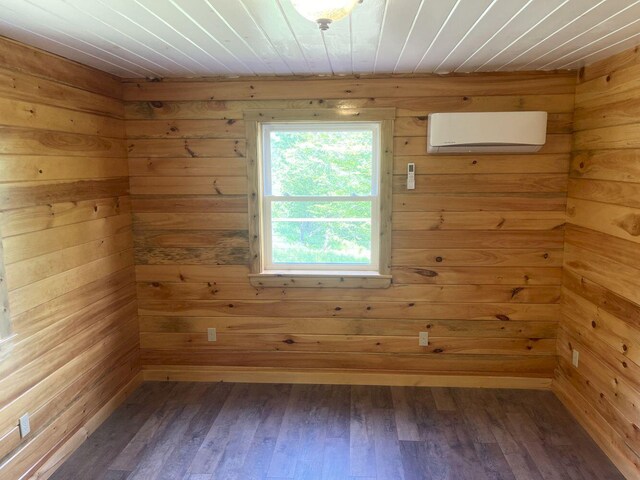 144 Redneck Rd, Starks, ME 04911 - spare room with a wall mounted air conditioner, wood finished floors, wooden walls, and wood ceiling