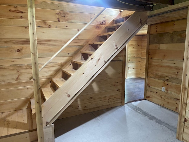 144 Redneck Rd, Starks, ME 04911 - stairs featuring wood walls and concrete flooring