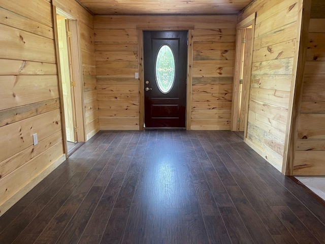 144 Redneck Rd, Starks, ME 04911 - foyer with dark wood-style floors, wooden ceiling, and wood walls