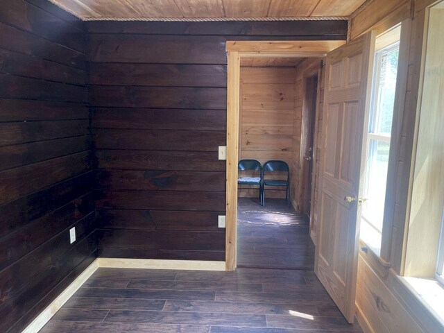 144 Redneck Rd, Starks, ME 04911 - hallway with wooden walls, wood finished floors, and wooden ceiling