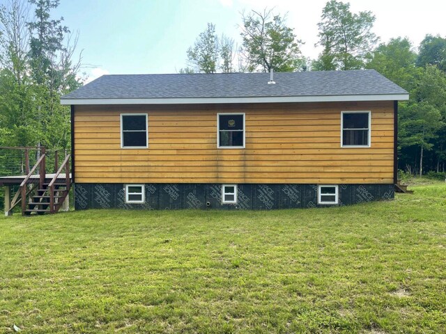144 Redneck Rd, Starks, ME 04911 - back of property featuring a lawn and stairs