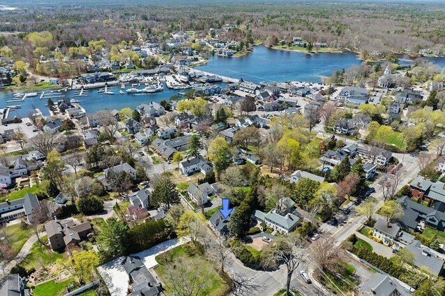drone / aerial view with a water view and a residential view