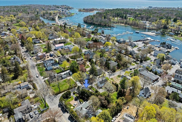 birds eye view of property with a water view and a residential view