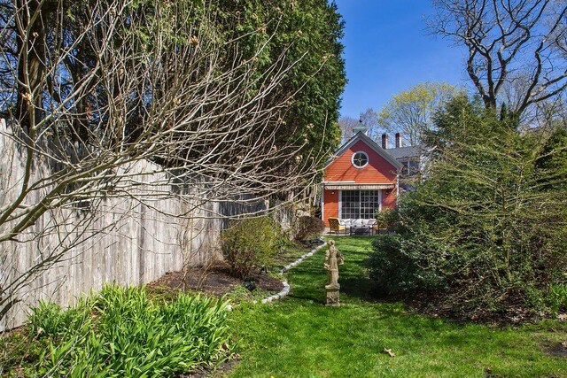 exterior space with a lawn and a chimney