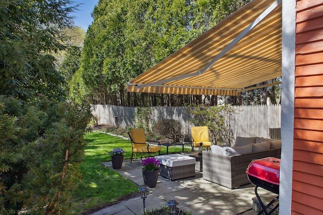 view of patio / terrace with fence and an outdoor living space