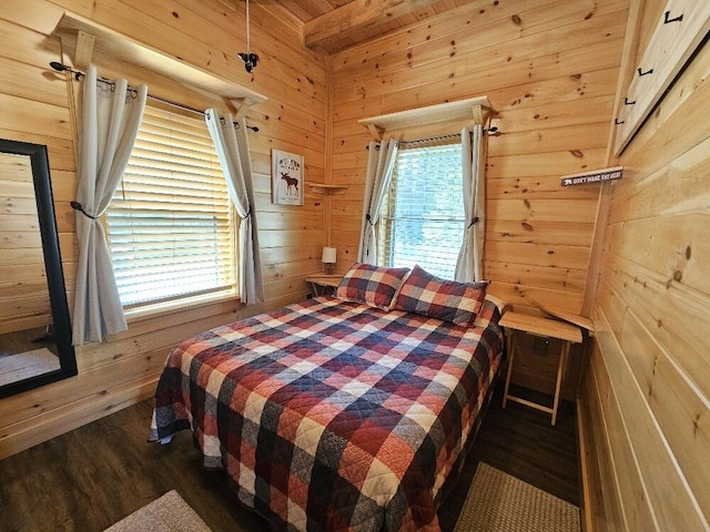 bedroom with dark wood-style flooring, wood walls, and wooden ceiling