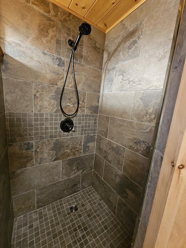 bathroom with tiled shower