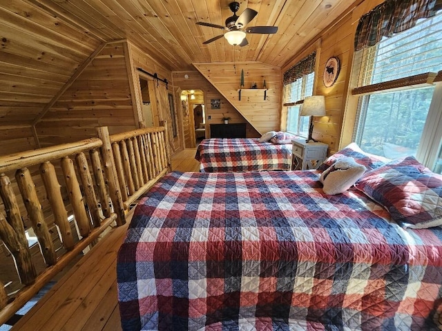 bedroom featuring wood ceiling, lofted ceiling, wooden walls, and hardwood / wood-style flooring