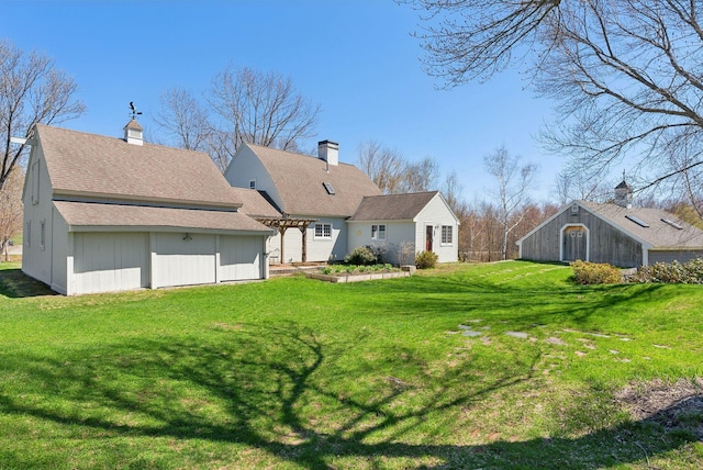 33 Smith Rd, Hallowell, ME 04347 - rear view of house with a yard and a pergola