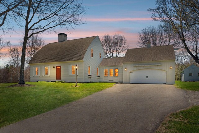 33 Smith Rd, Hallowell, ME 04347 - cape cod-style house featuring a lawn, an attached garage, a chimney, and aphalt driveway