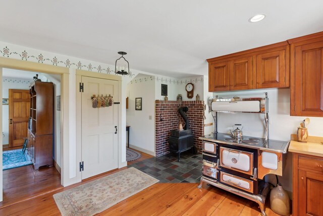 33 Smith Rd, Hallowell, ME 04347 - entryway featuring a wood stove and light wood-type flooring