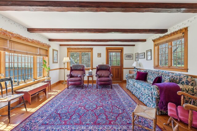 33 Smith Rd, Hallowell, ME 04347 - living room with baseboards, beam ceiling, and wood finished floors