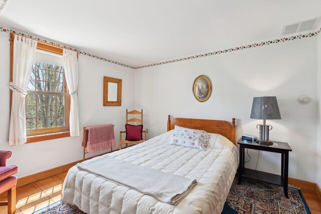33 Smith Rd, Hallowell, ME 04347 - bedroom with wood finished floors, visible vents, and baseboards