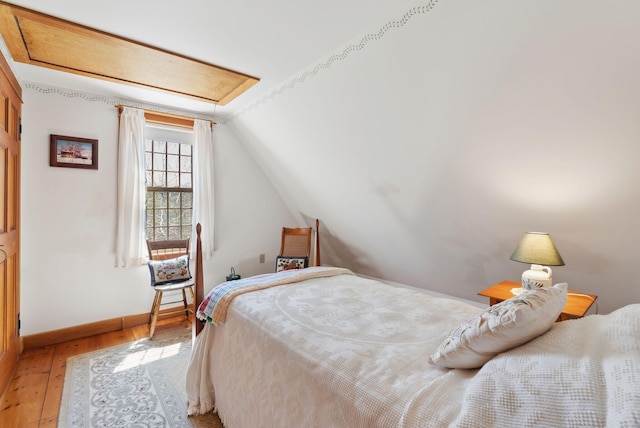 33 Smith Rd, Hallowell, ME 04347 - bedroom featuring vaulted ceiling, baseboards, and light wood-style floors