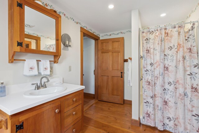 33 Smith Rd, Hallowell, ME 04347 - bathroom with wood finished floors, a shower with curtain, baseboards, vanity, and recessed lighting