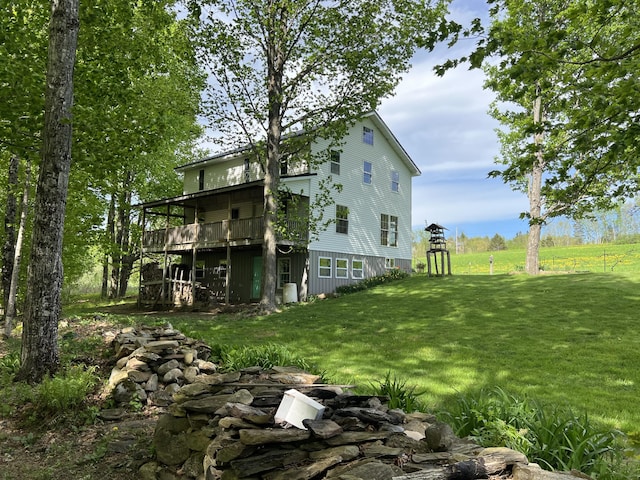 142 Palmer Rd, Thorndike, ME 04986 - view of property exterior with a yard and a wooden deck