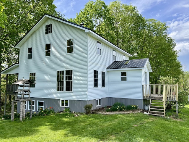 142 Palmer Rd, Thorndike, ME 04986 - rear view of property featuring a deck and a yard