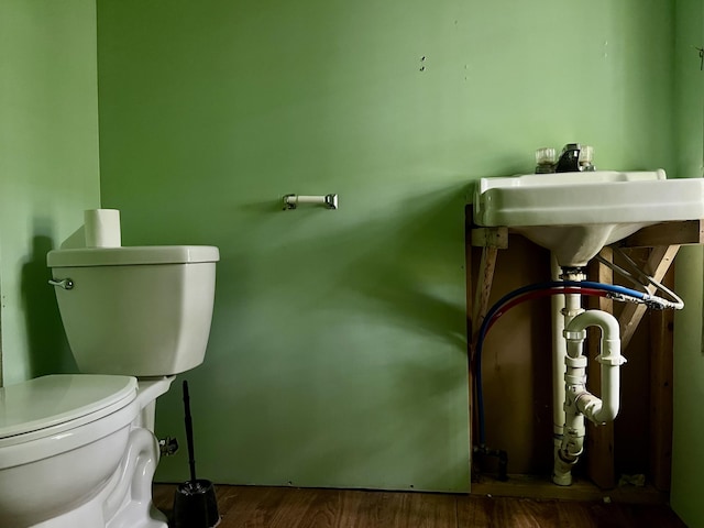 142 Palmer Rd, Thorndike, ME 04986 - bathroom with toilet and wood finished floors
