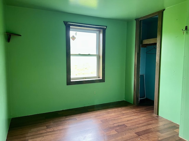 142 Palmer Rd, Thorndike, ME 04986 - unfurnished bedroom featuring wood finished floors