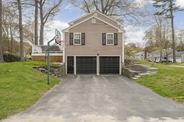 13 Juniper Ln, Cape Elizabeth, ME 04107 - view of side of home with asphalt driveway, a garage, and a yard