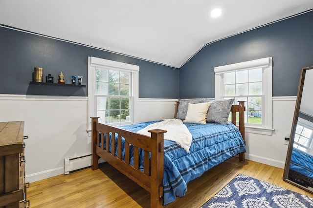 13 Juniper Ln, Cape Elizabeth, ME 04107 - bedroom featuring vaulted ceiling, hardwood / wood-style flooring, a baseboard heating unit, multiple windows, and baseboards