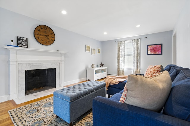 13 Juniper Ln, Cape Elizabeth, ME 04107 - living area with a high end fireplace, wood finished floors, recessed lighting, and baseboards