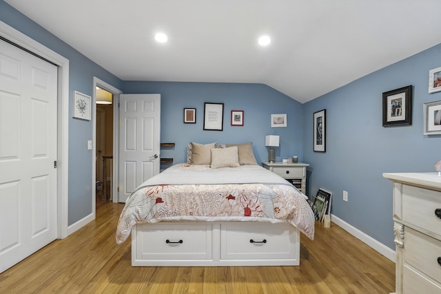 13 Juniper Ln, Cape Elizabeth, ME 04107 - bedroom with light wood finished floors, baseboards, recessed lighting, and lofted ceiling