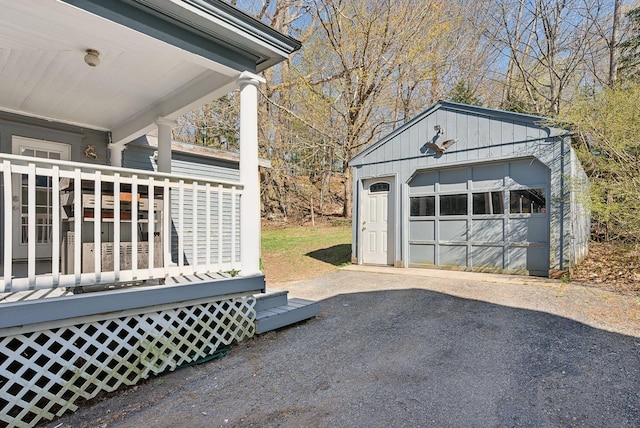 detached garage with aphalt driveway