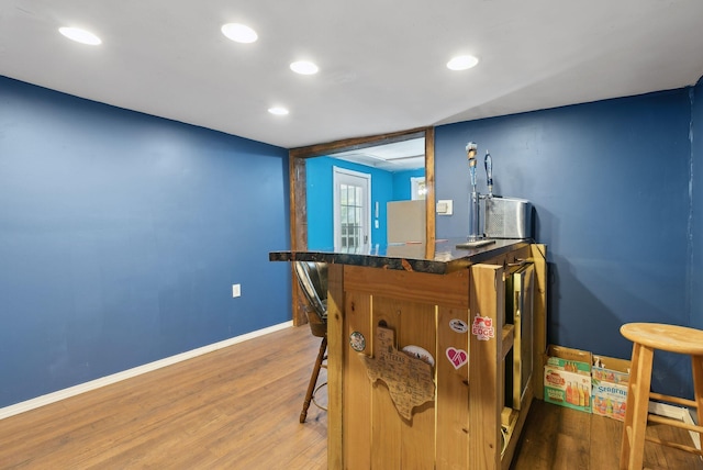 game room featuring baseboards, recessed lighting, and wood finished floors