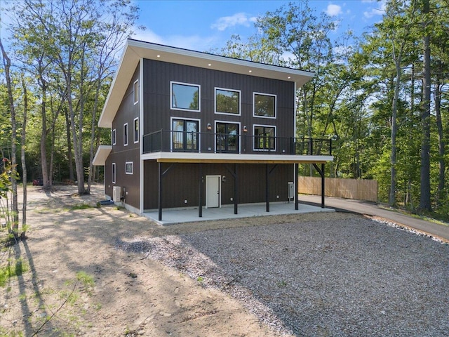 676 Sebago Rd, Sebago, ME 04029 - back of house featuring fence and a patio area