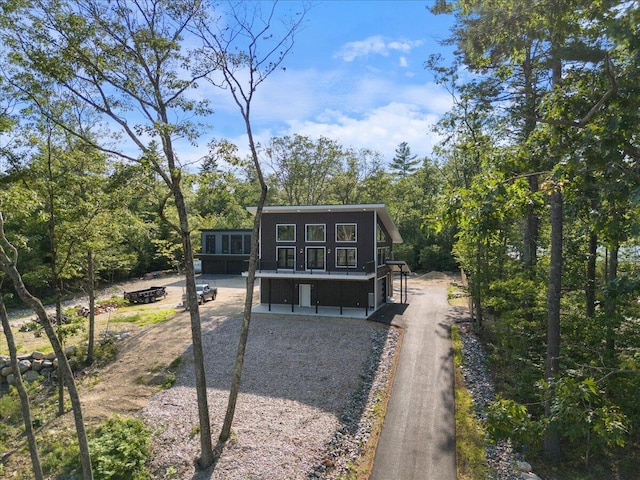 676 Sebago Rd, Sebago, ME 04029 - view of front facade featuring a sunroom