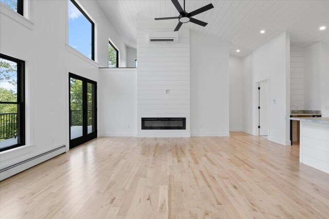 676 Sebago Rd, Sebago, ME 04029 - unfurnished living room featuring french doors, light wood finished floors, ceiling fan, and high vaulted ceiling