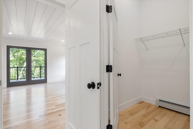 676 Sebago Rd, Sebago, ME 04029 - interior space featuring baseboards, a baseboard heating unit, and light wood-type flooring