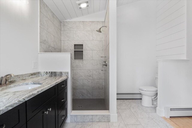 676 Sebago Rd, Sebago, ME 04029 - full bathroom with a walk in shower, baseboard heating, vanity, and marble finish floor